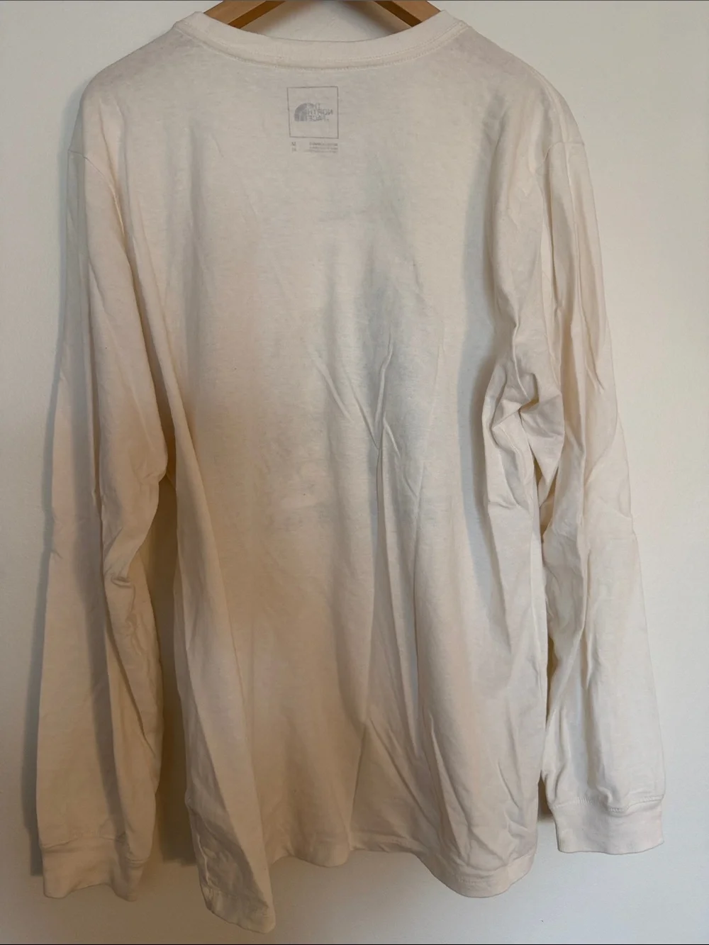 The North Face Cream Long Sleeve Graphic Tee with Multicolor Mountain Print
